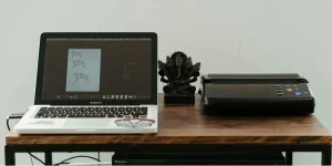 Macbook Pro on Brown Wooden Table