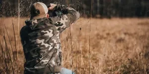 Man Wearing Camo Jumper Photographing Nature