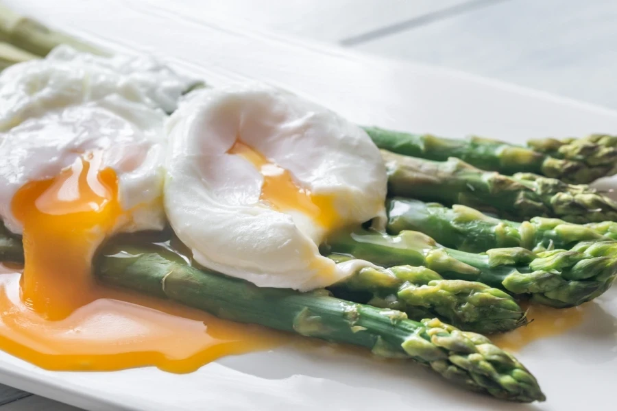 Poached eggs on top of asparagus