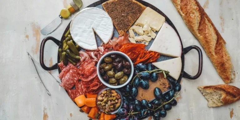 Round metal charcuterie platter with handles