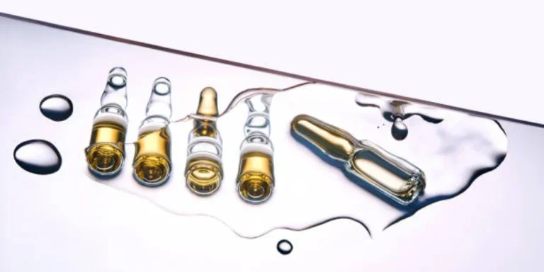 Selection of ampoule serum vials spread out in liquid