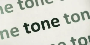 The word “tone” printed on paper