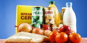 Various consumer packaged goods on a blue background