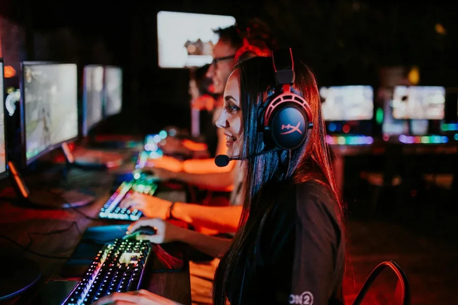 Woman and Man at Computers in Gaming Center