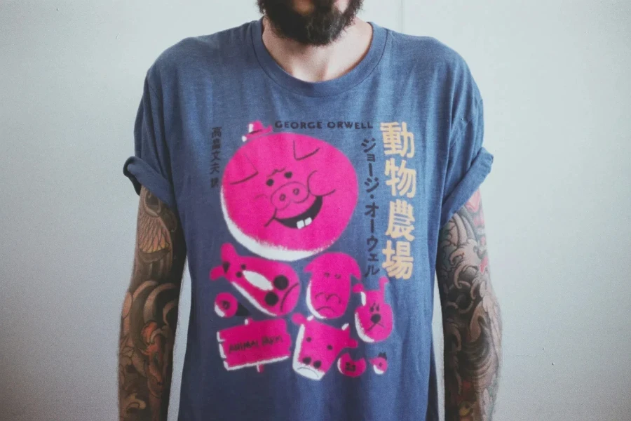 a man wearing a printed t-shirt in grey