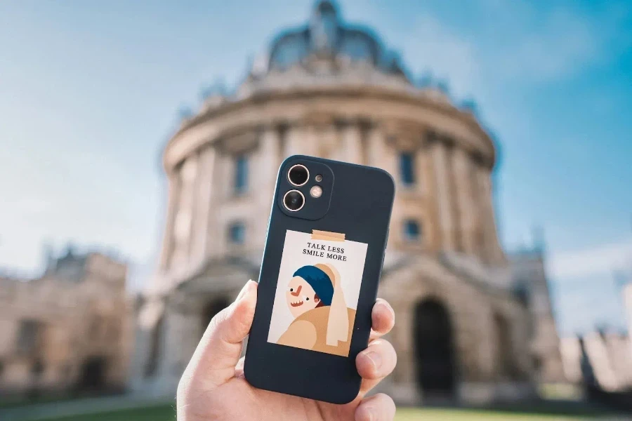 A person holding his phone with a mobile case