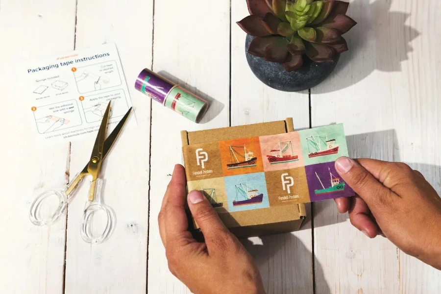 A person using brand stickers for packaging an order