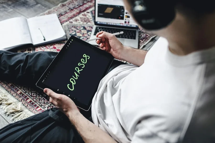 A person working on a tablet with pen