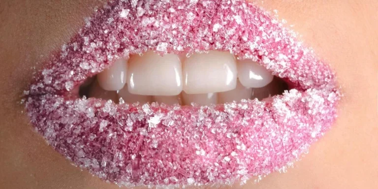 a person’s lips covered in white granules