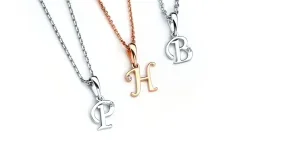 A set of three elegant bubble letter necklaces
