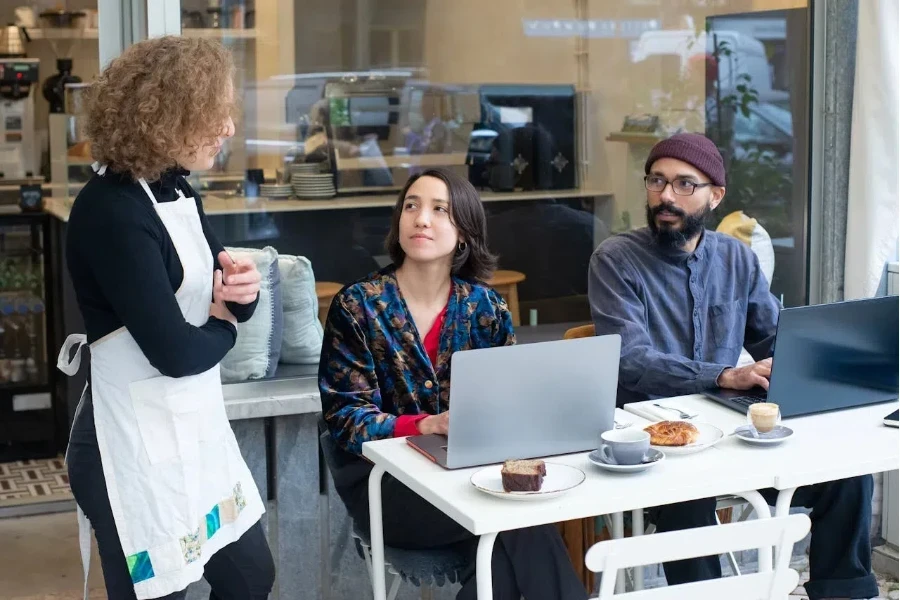 a waitress interacting with customers