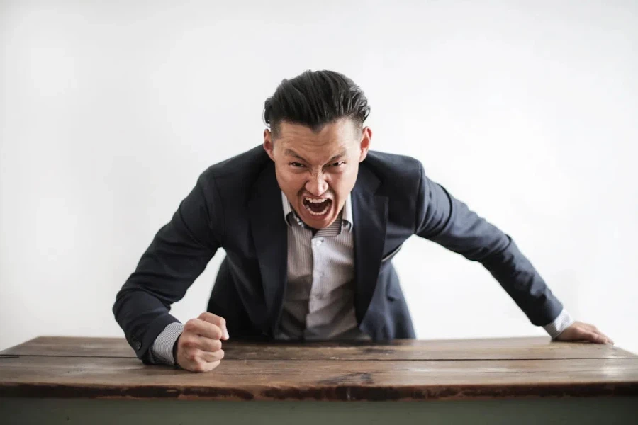 An angry executive banging a table