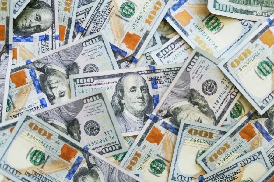 Close-up shot of pile of 100 US dollar bills