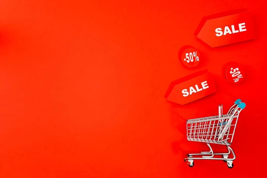 Mini shopping cart with sales tags around it