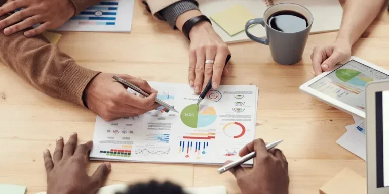 People discussing business graphics