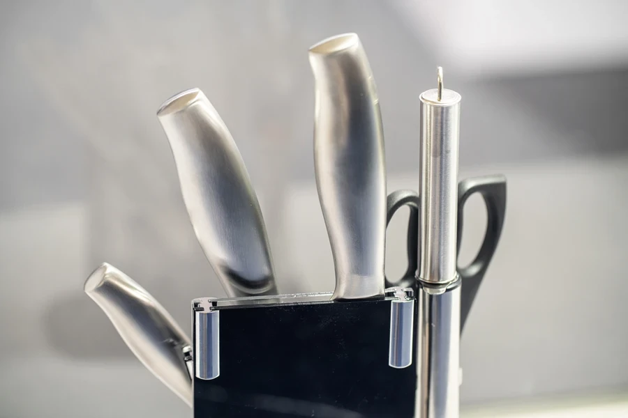 set of new kitchen knives in a stand