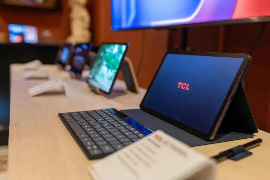 Three laptops lined up on a desk