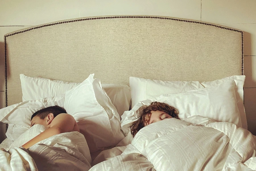 two children sleeping in their bed