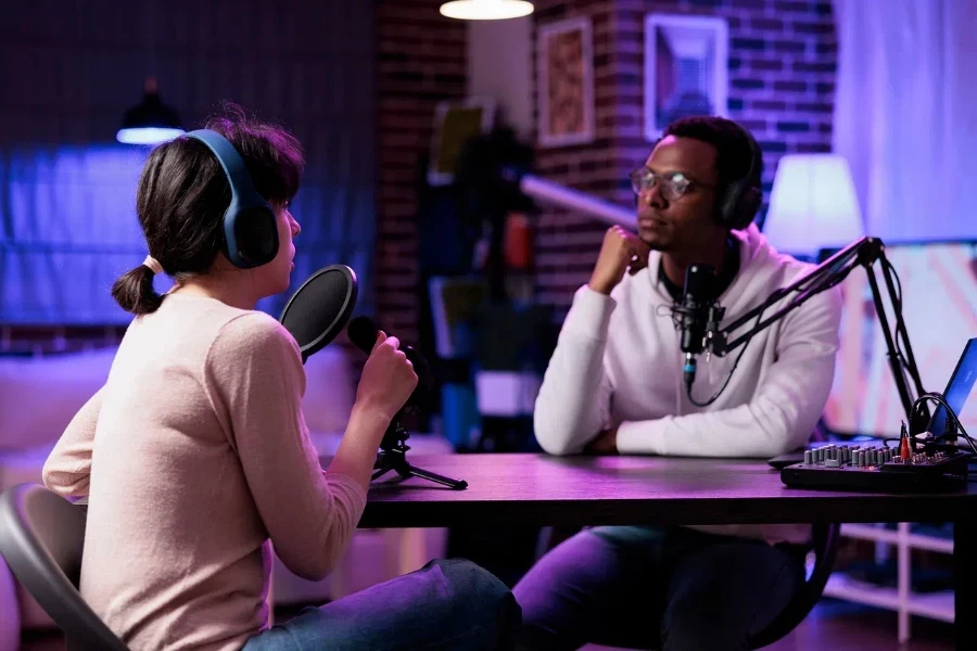 Two people talking in a podcast