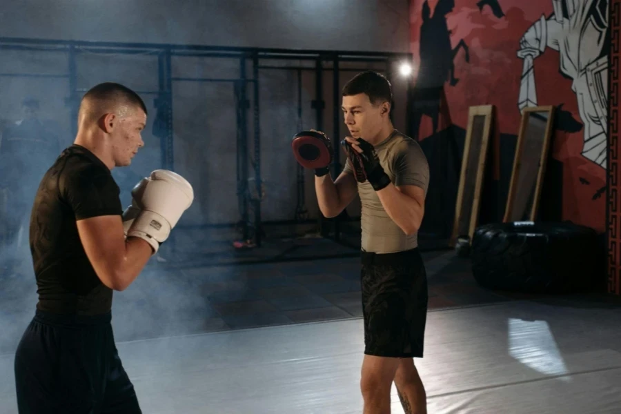 A Man Working Out with His Trainer