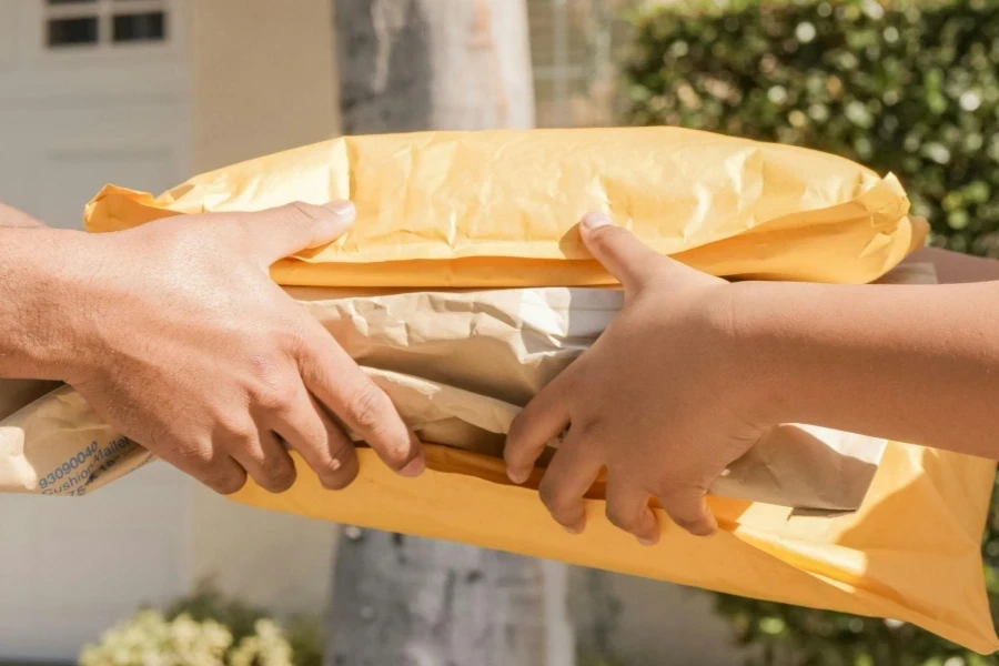 A Person Handing Over Delivery Packages