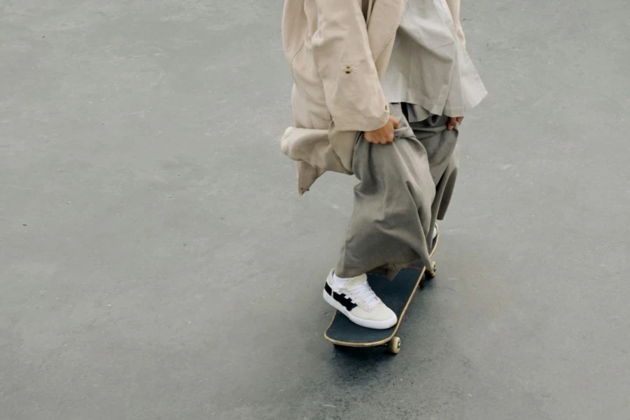 A Person Wearing Loose Clothes Riding a Skateboard