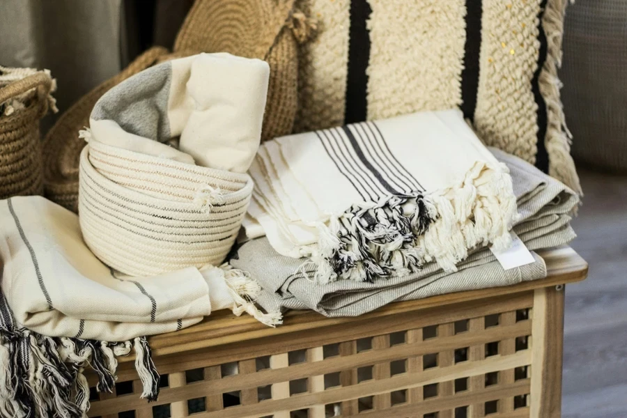 A basket with blankets and a basket with a blanket on it