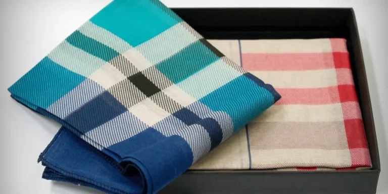 A blue and white plaid folded on a black tray