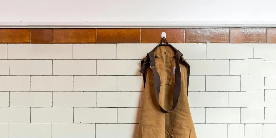 A brown apron on a hook
