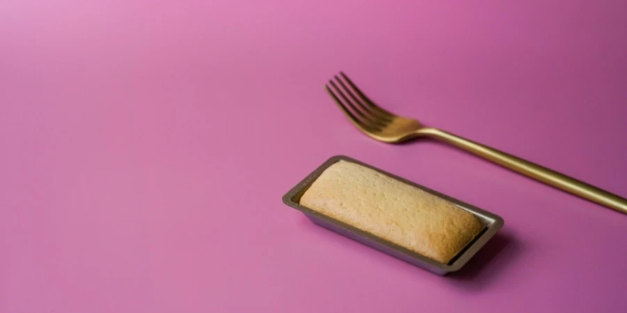 A fork and a cake in a tin