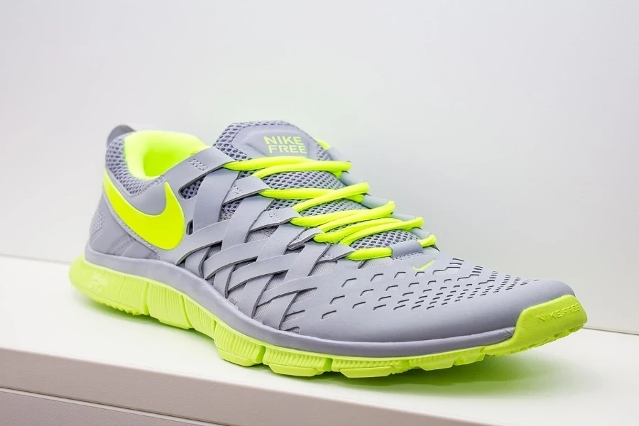 A gray pickleball shoe on white surface
