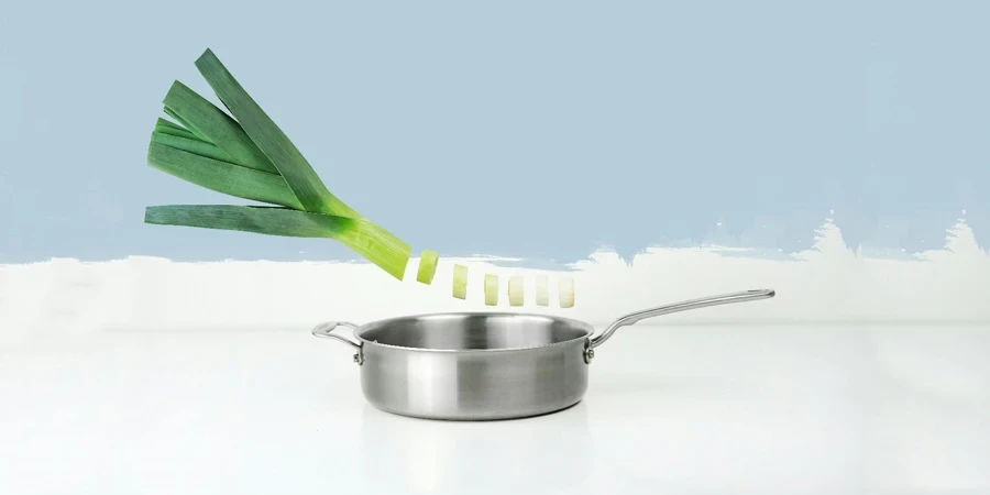 A green onion being poured into a pan