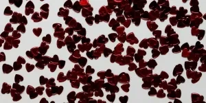 A group of red hearts with Black Forest in the background