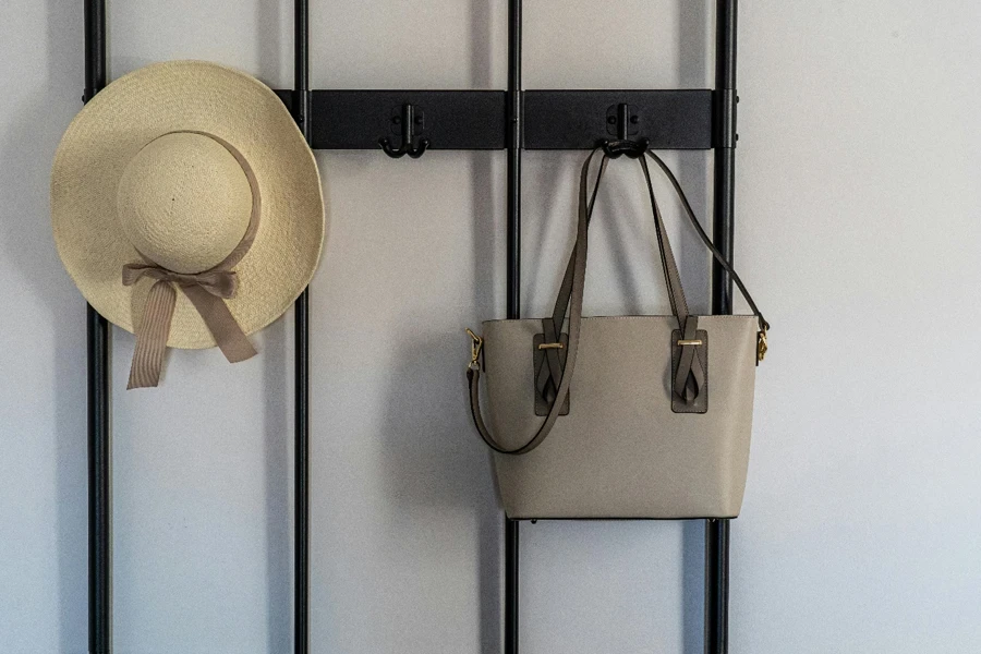 A hat and purse on a wall
