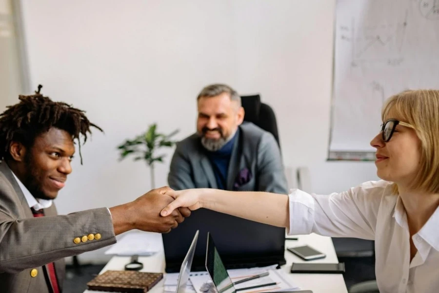 A man closing a deal with his clients