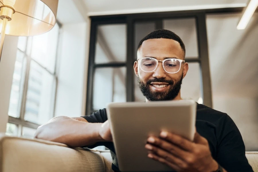 A man smiling while shopping online