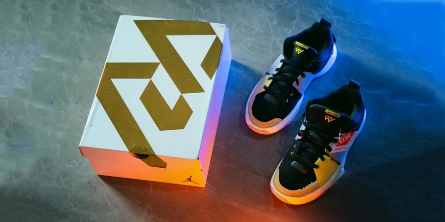 A pair of shoes next to a box
