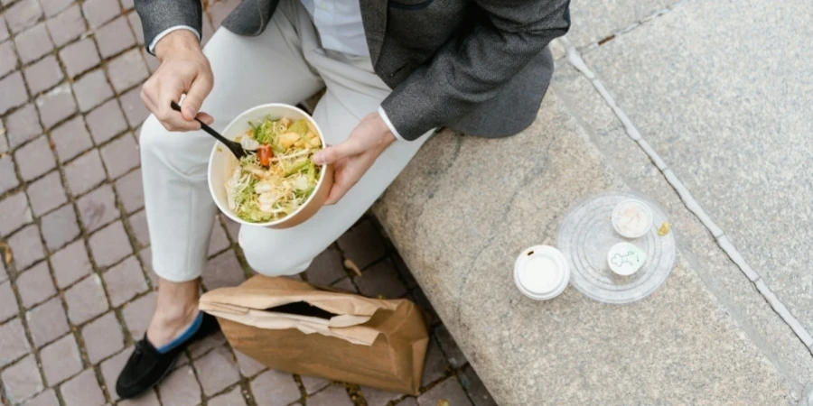 A person eating a bowl of food