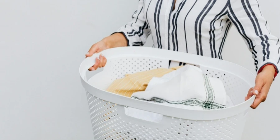 A person holding a laundry basket