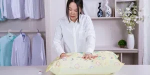 A person holding a vacuum storage bag