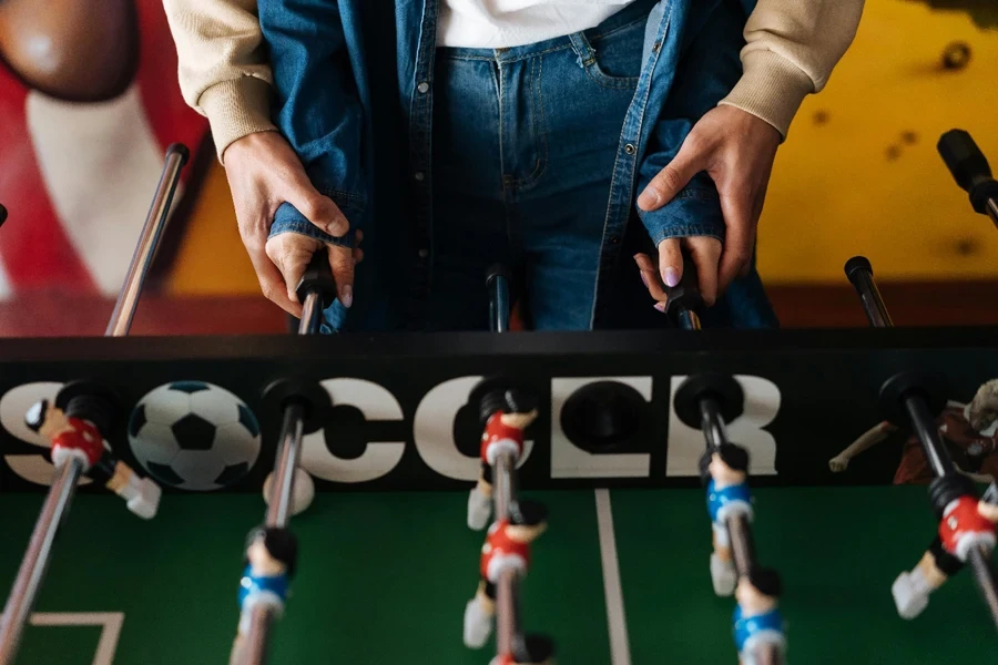A person playing foosball