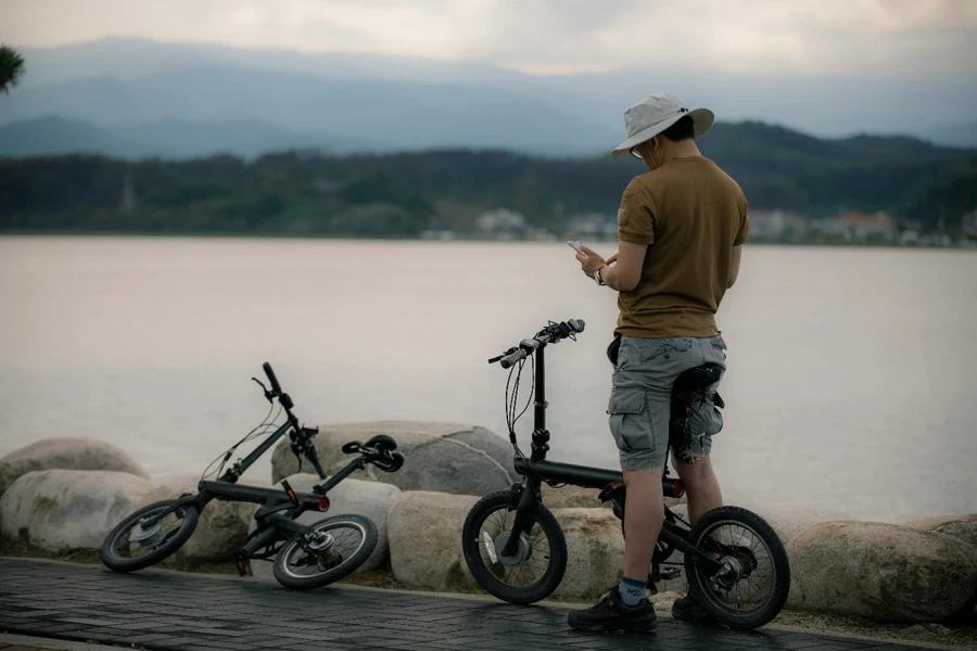 A person standing next to a bicycle