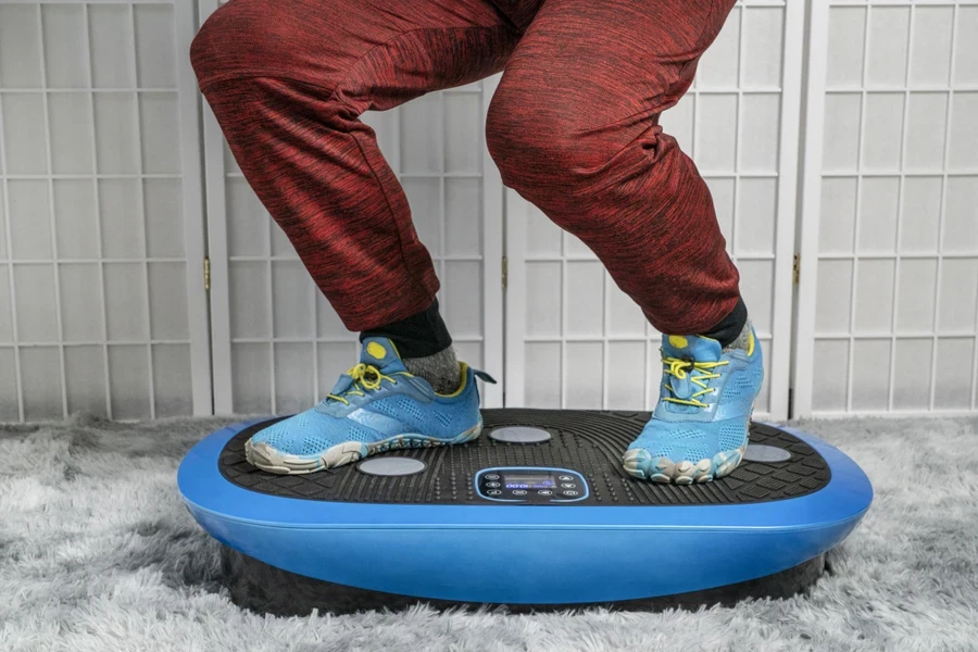 A person standing on a vibration plate exercise machine