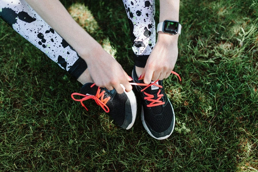 A person tying their shoes