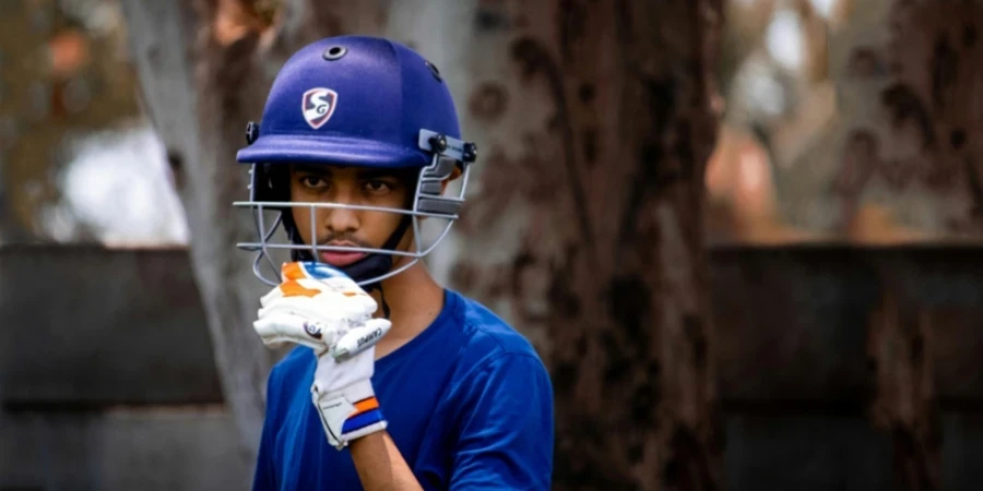 A person wearing a helmet and gloves