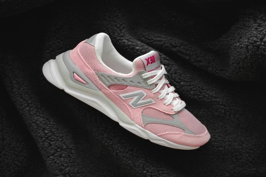A pink, white, and gray pickleball shoe