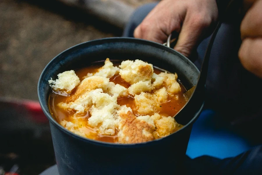 A pot of soup with food in it
