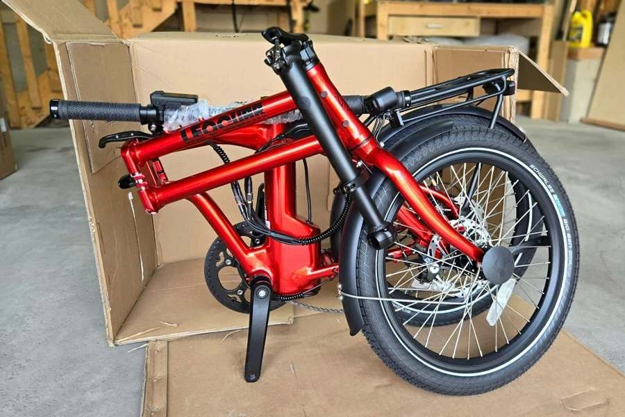 A red and black bicycle in a box
