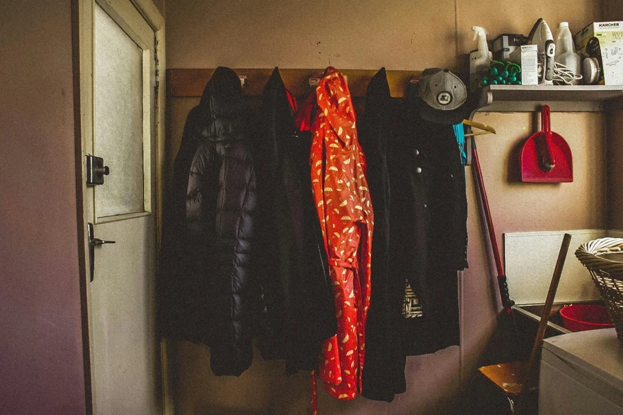 A room with coats on a wall