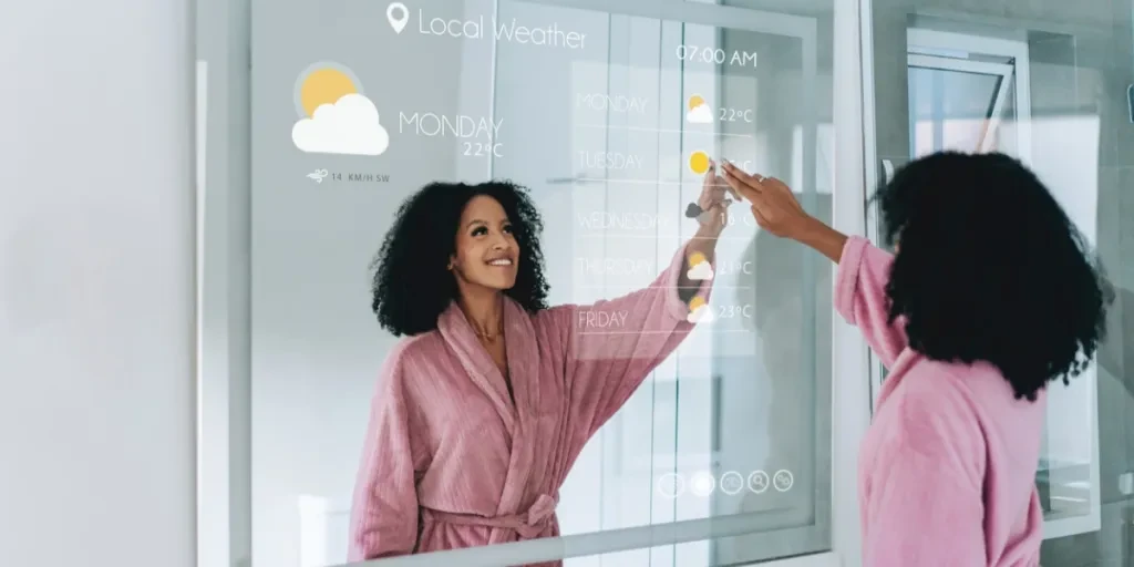 A woman checking the weather on a digital mirror